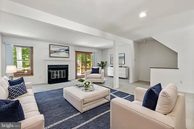 a bedroom with a bed and a potted plant