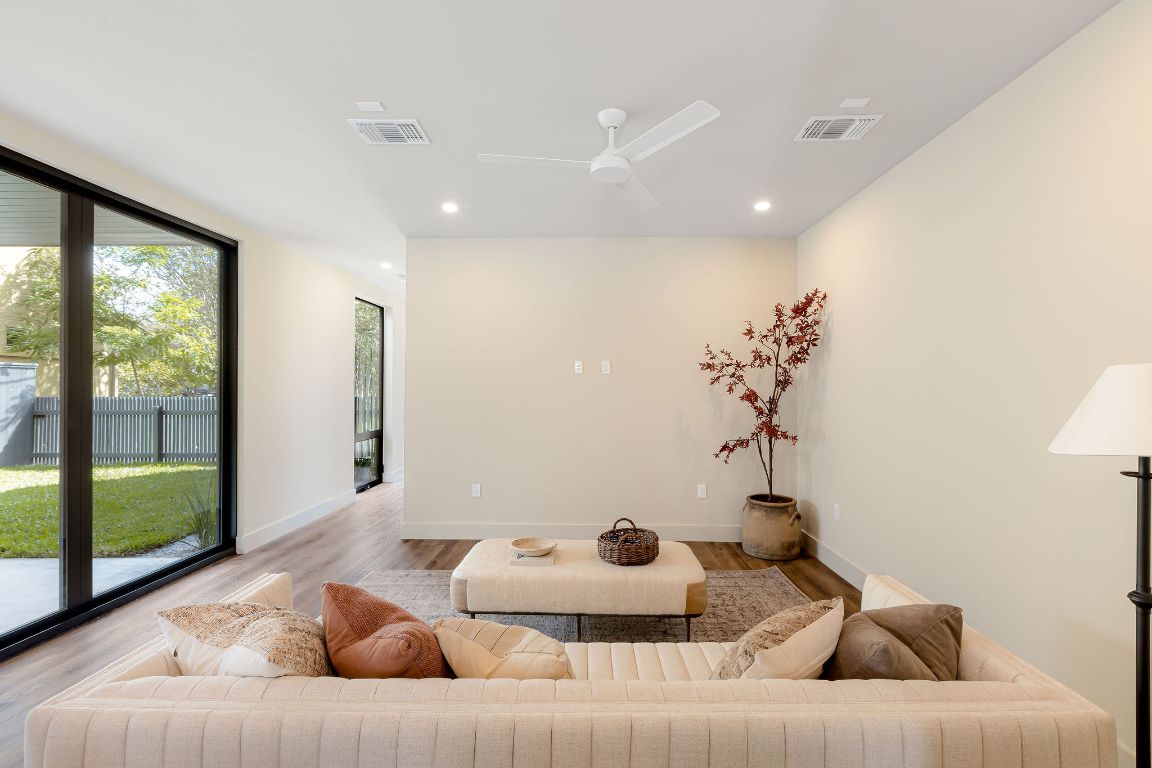 4412 Banister Lane, Unit 1 Austin, TX 78745 - Photo 13 of 40 a living room with furniture and a large window