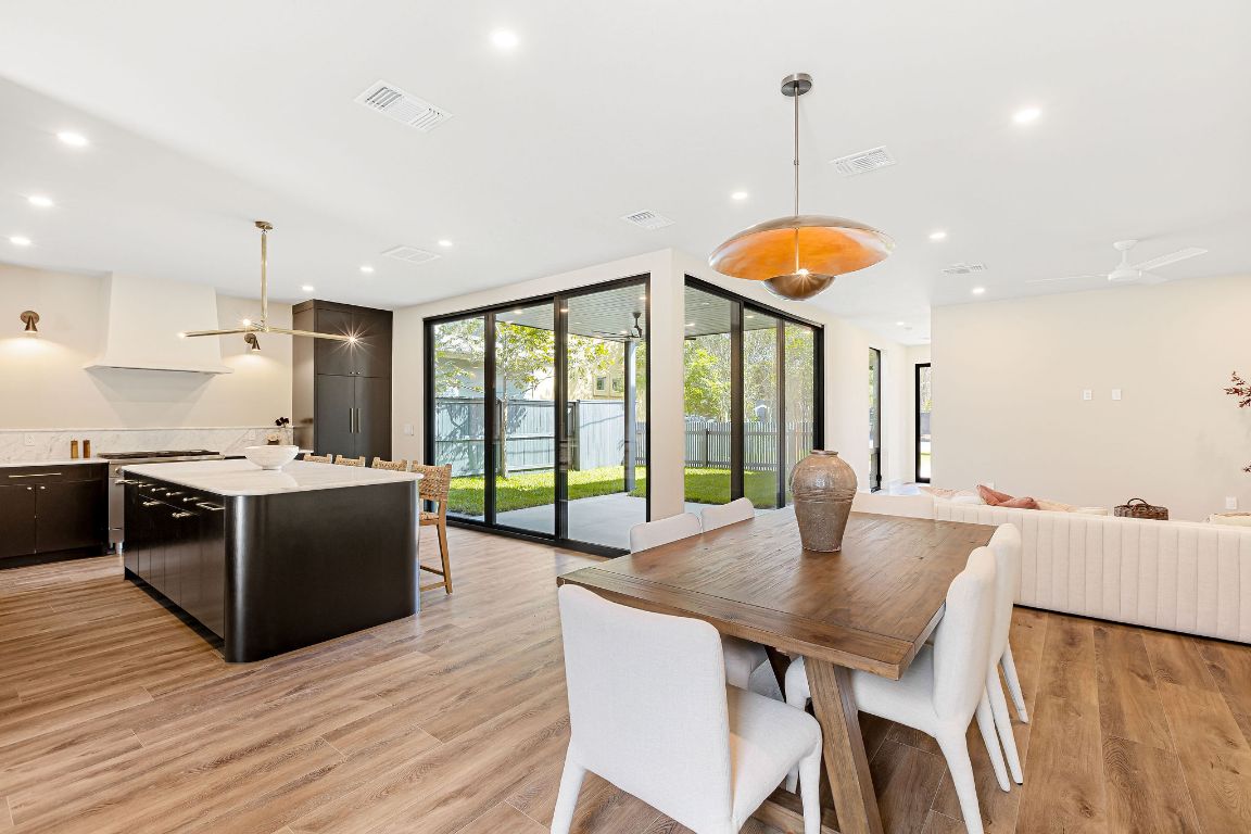 4412 Banister Lane, Unit 1 Austin, TX 78745 - Photo 18 of 40 a large kitchen with a table and chairs