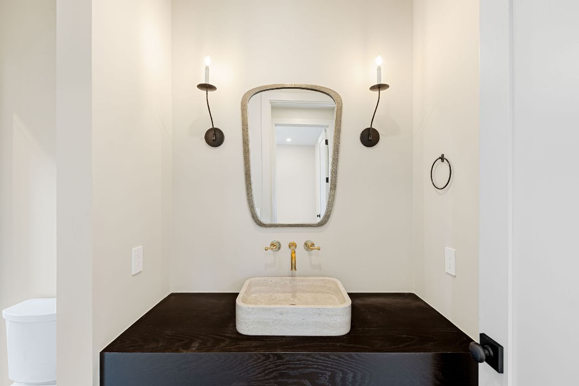 4412 Banister Lane, Unit 1 Austin, TX 78745 - Photo 22 of 40 a bathroom with a sink and a mirror