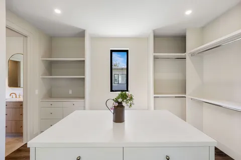 a kitchen with a refrigerator and window