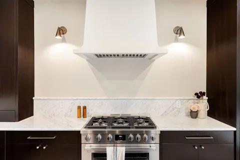 a kitchen with a stove and cabinets