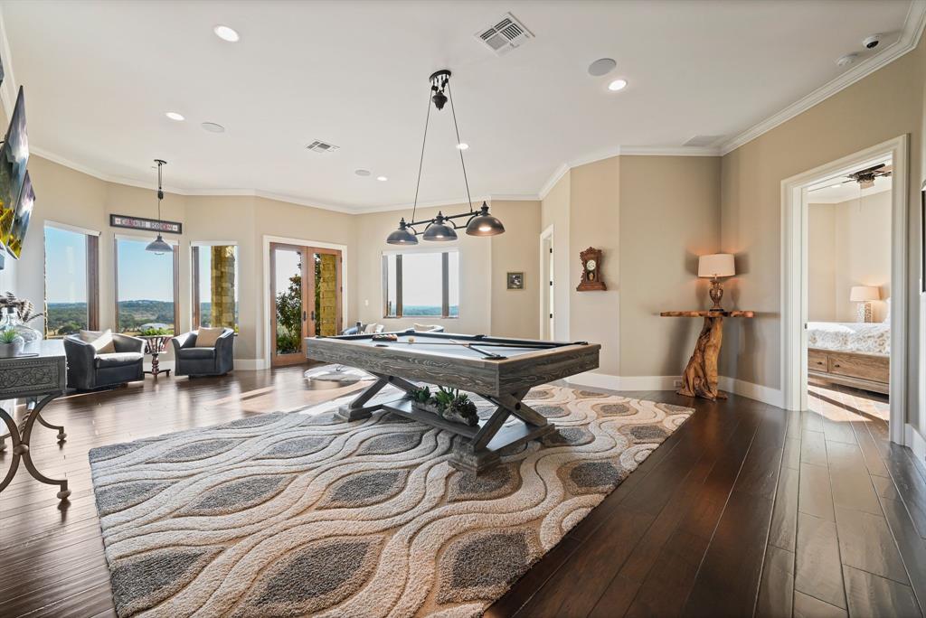 325 River Ridge Spring Branch, TX 78070 - Photo 20 of 40 a living room with furniture a wooden floor and a chandelier