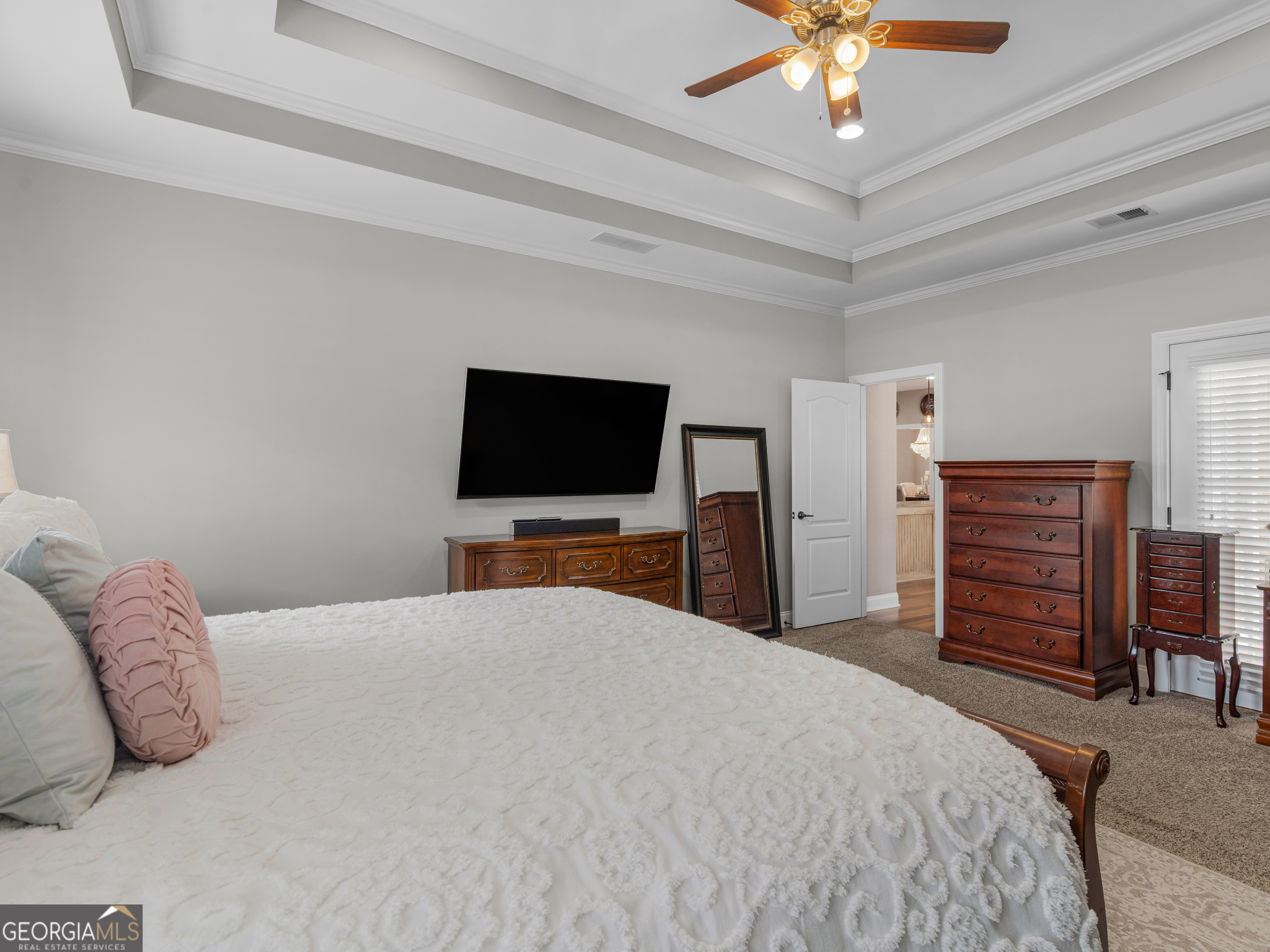 221 Hummingbird Court Hampton, GA 30228 - Photo 42 of 77 a bedroom with a bed and a flat screen tv