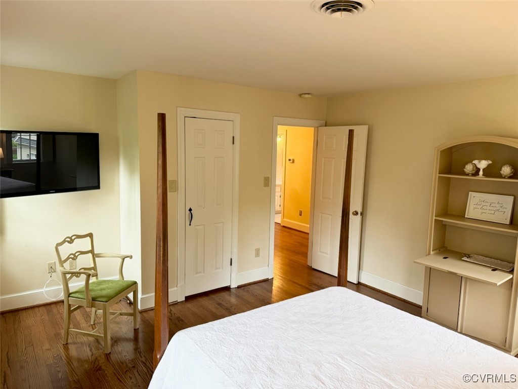 209 Running Cedar Lane Henrico, VA 23229 - Photo 19 of 29 a bedroom with a bed and flat tv screen on the dresser