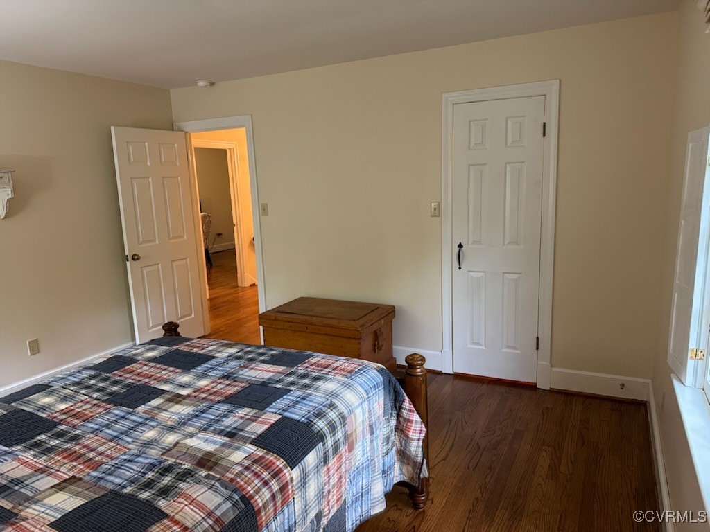 209 Running Cedar Lane Henrico, VA 23229 - Photo 21 of 29 a bedroom with a bed and a wooden floor