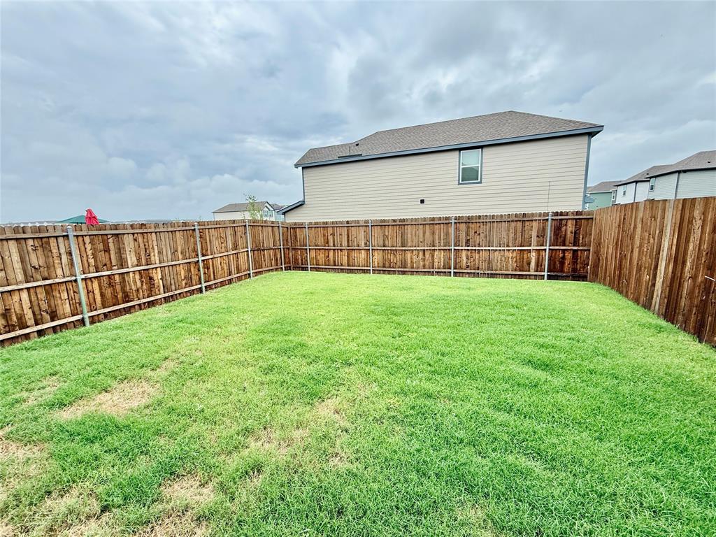 6114 Holly Spg Road Princeton, TX 75407 - Photo 7 of 7 a view of a backyard with a garden