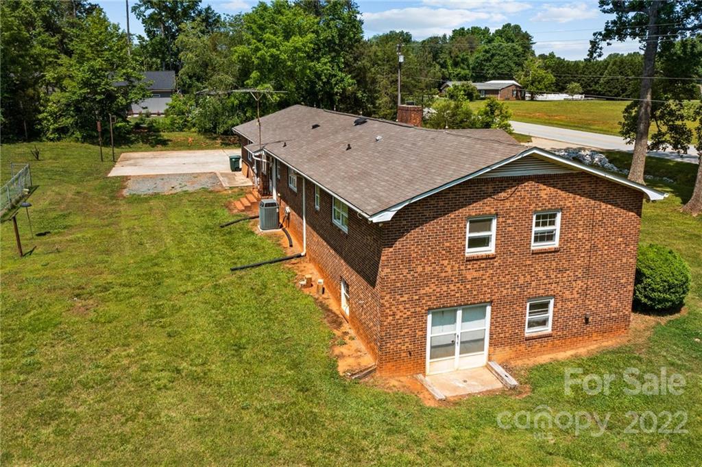 6525 Bringle Ferry Road Salisbury, NC 28146 - Photo 7 of 22 a aerial view of a house with swimming pool and a yard