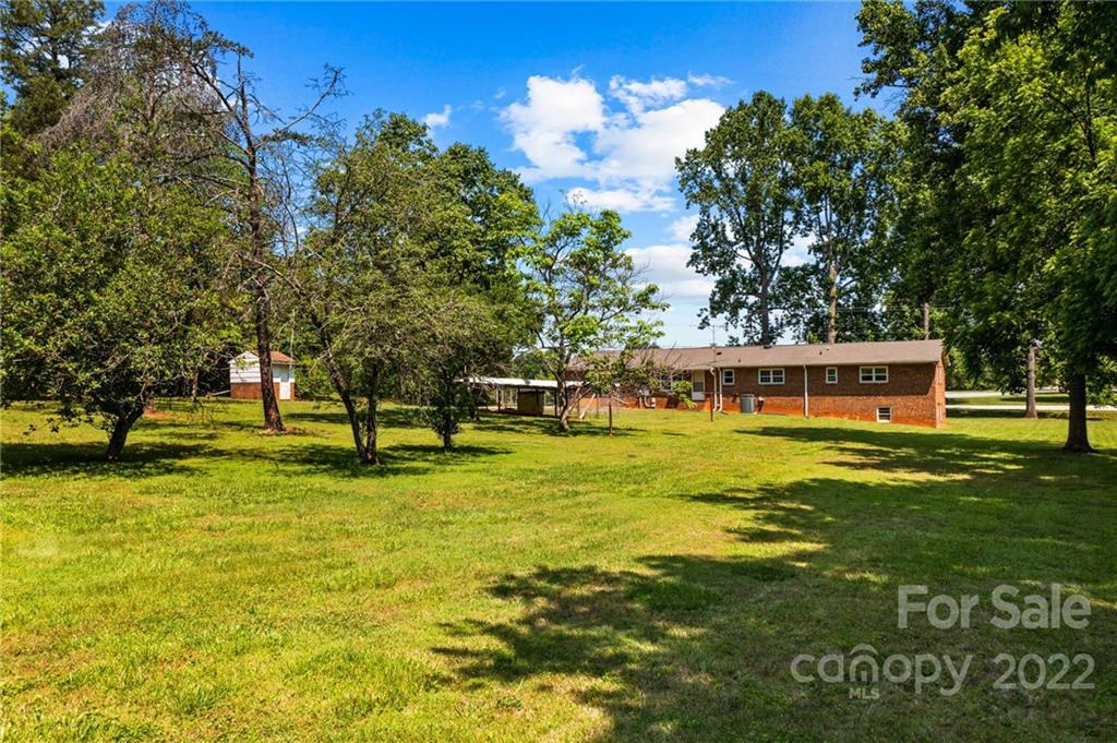 6525 Bringle Ferry Road Salisbury, NC 28146 - Photo 8 of 22 a view of a house with a swimming pool