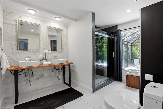 a bathroom with a sink double vanity and a mirror