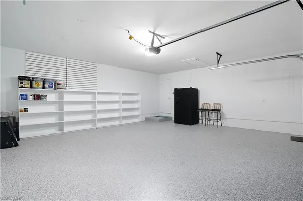 a view of empty room with cabinet and ceiling fan