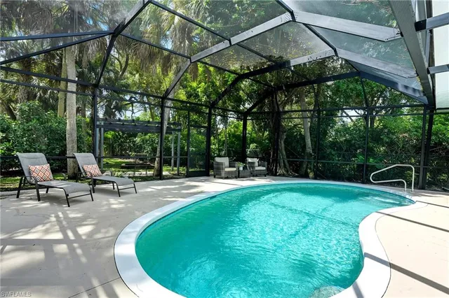 a view of a swimming pool with a patio