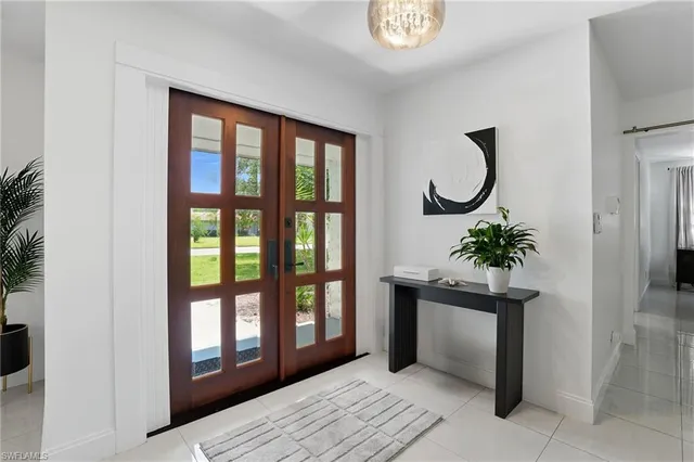 a view of a room that has a fountain and a potted plant on the wall