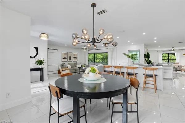 a dining room with furniture and window