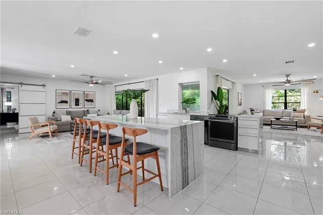 a kitchen with lots of counter top space and appliances