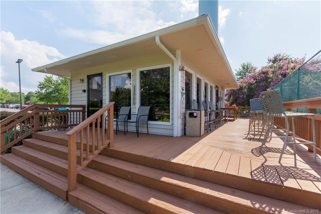 4151 Koala Circle Tega Cay, SC 29708 - Photo 22 of 27 a view of a house with wooden deck and furniture