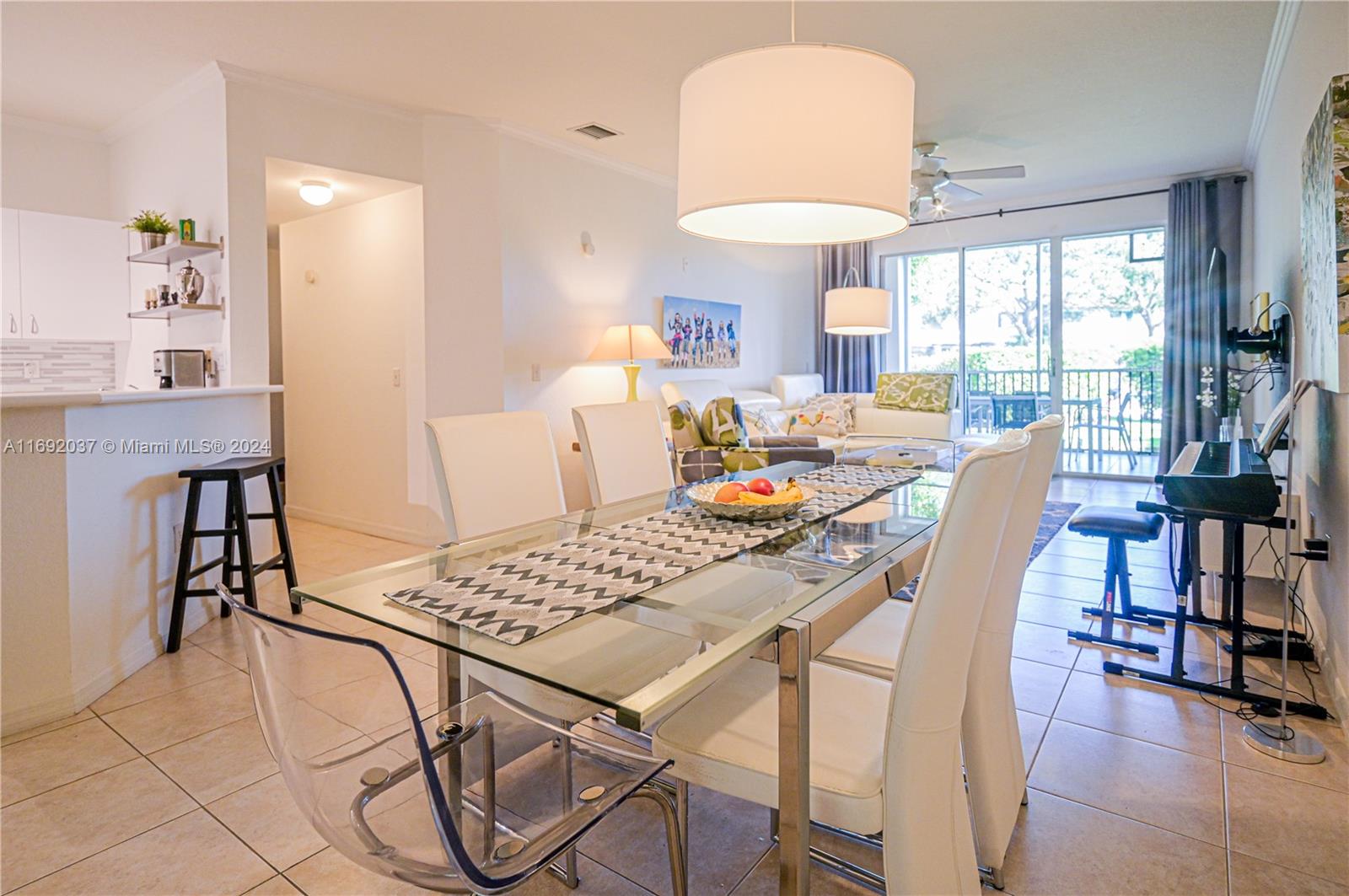75 Gulfstream Road, Unit 107B Dania Beach, FL 33004 - Photo 13 of 71 a dining room with furniture and window
