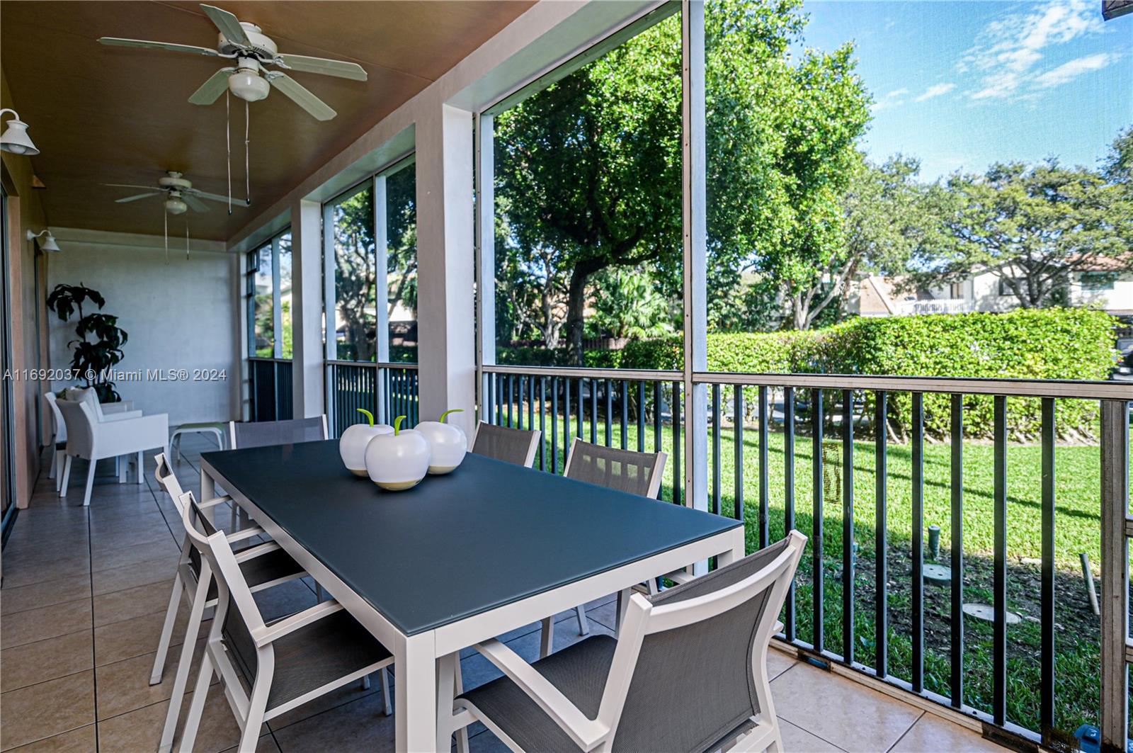 75 Gulfstream Road, Unit 107B Dania Beach, FL 33004 - Photo 25 of 71 a view of a balcony dining table and chairs