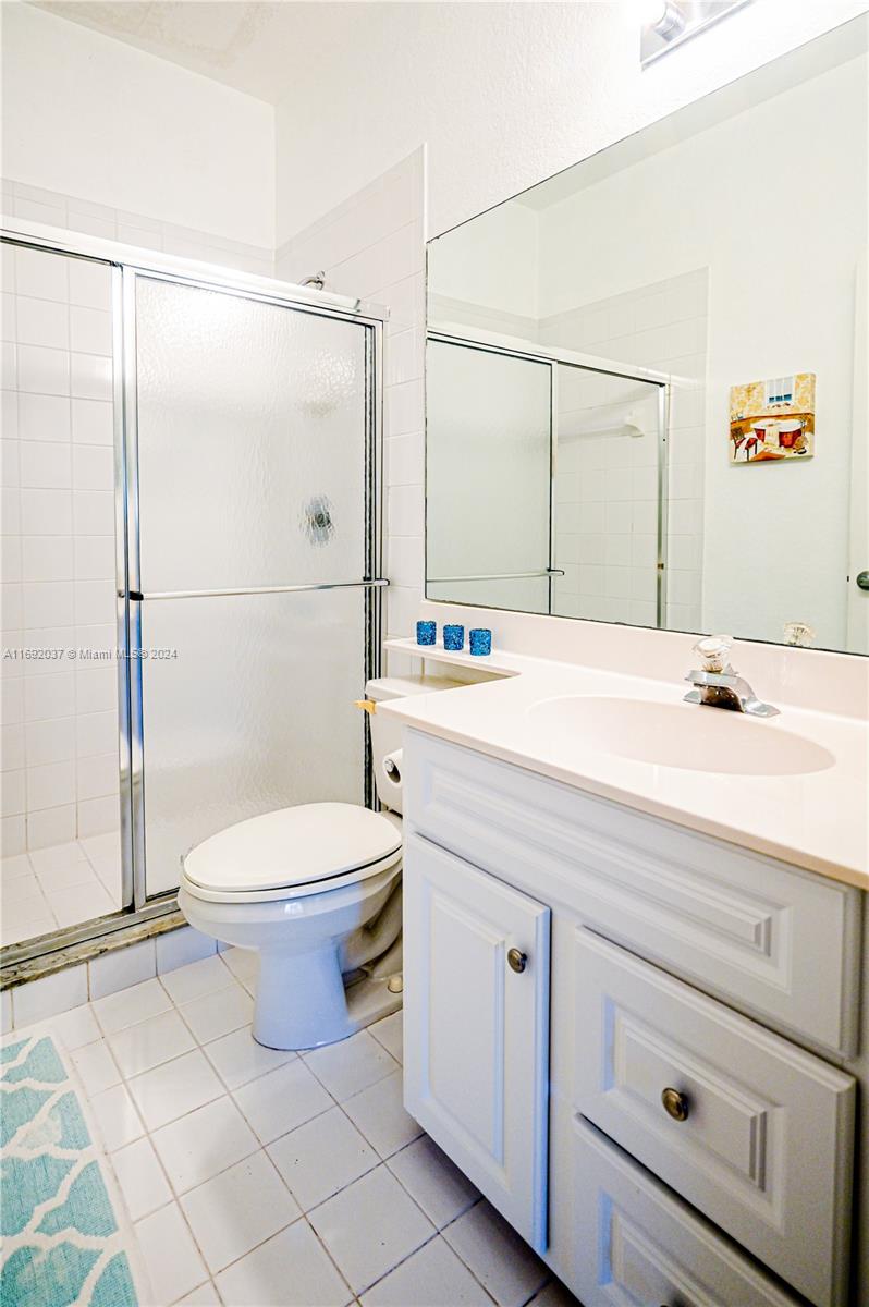 75 Gulfstream Road, Unit 107B Dania Beach, FL 33004 - Photo 31 of 71 a bathroom with a sink a toilet and shower