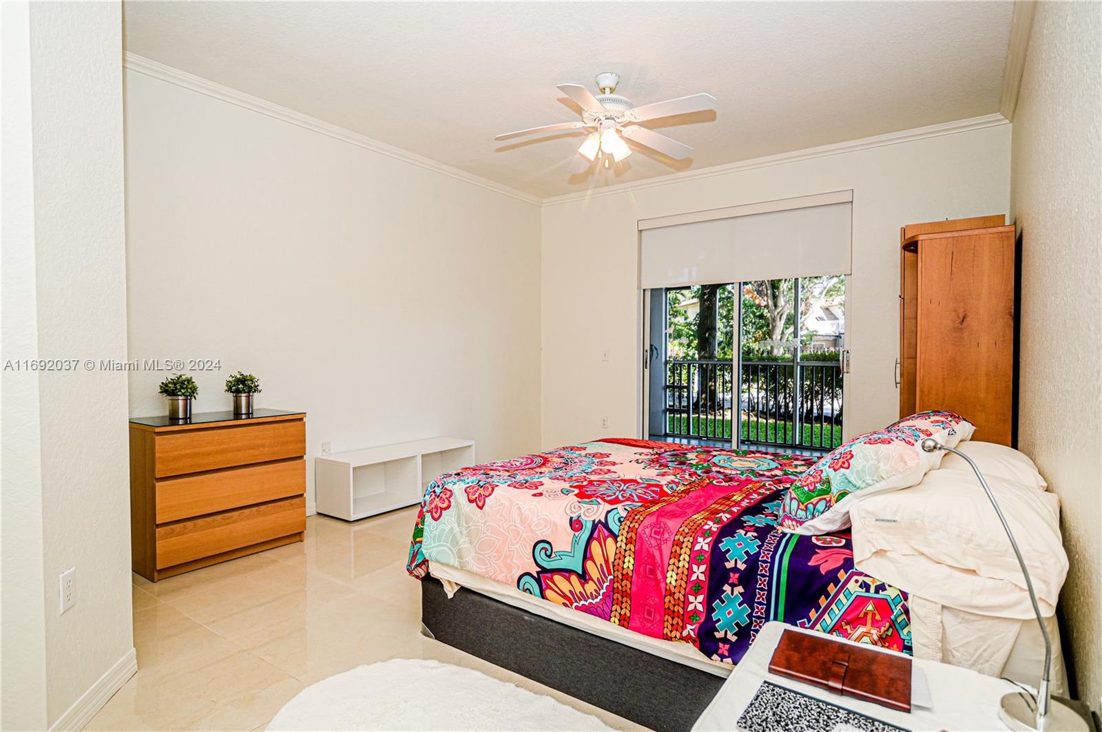 75 Gulfstream Road, Unit 107B Dania Beach, FL 33004 - Photo 40 of 71 a bedroom with a bed and a window