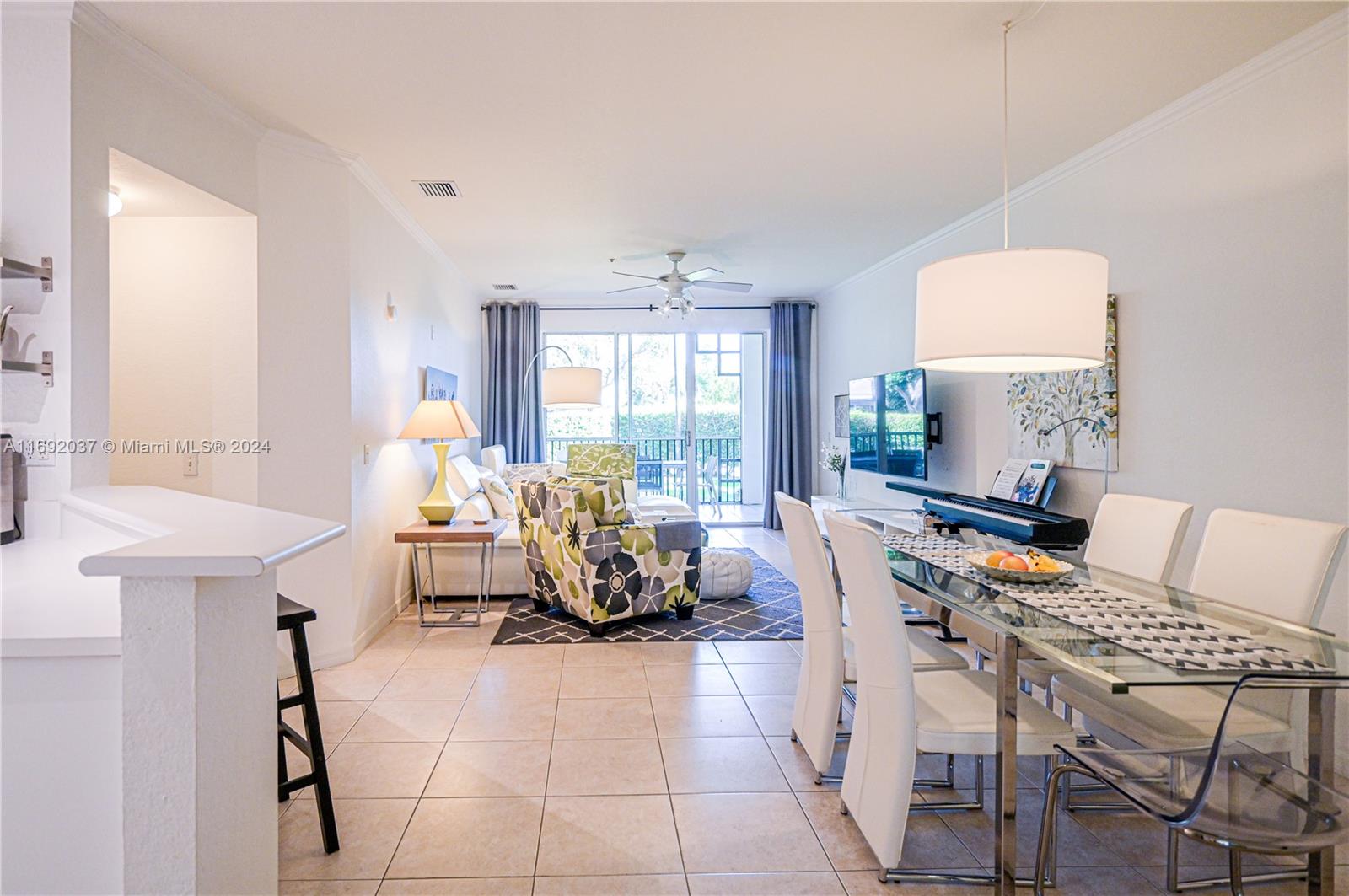 75 Gulfstream Road, Unit 107B Dania Beach, FL 33004 - Photo 4 of 71 a living room with furniture and a window