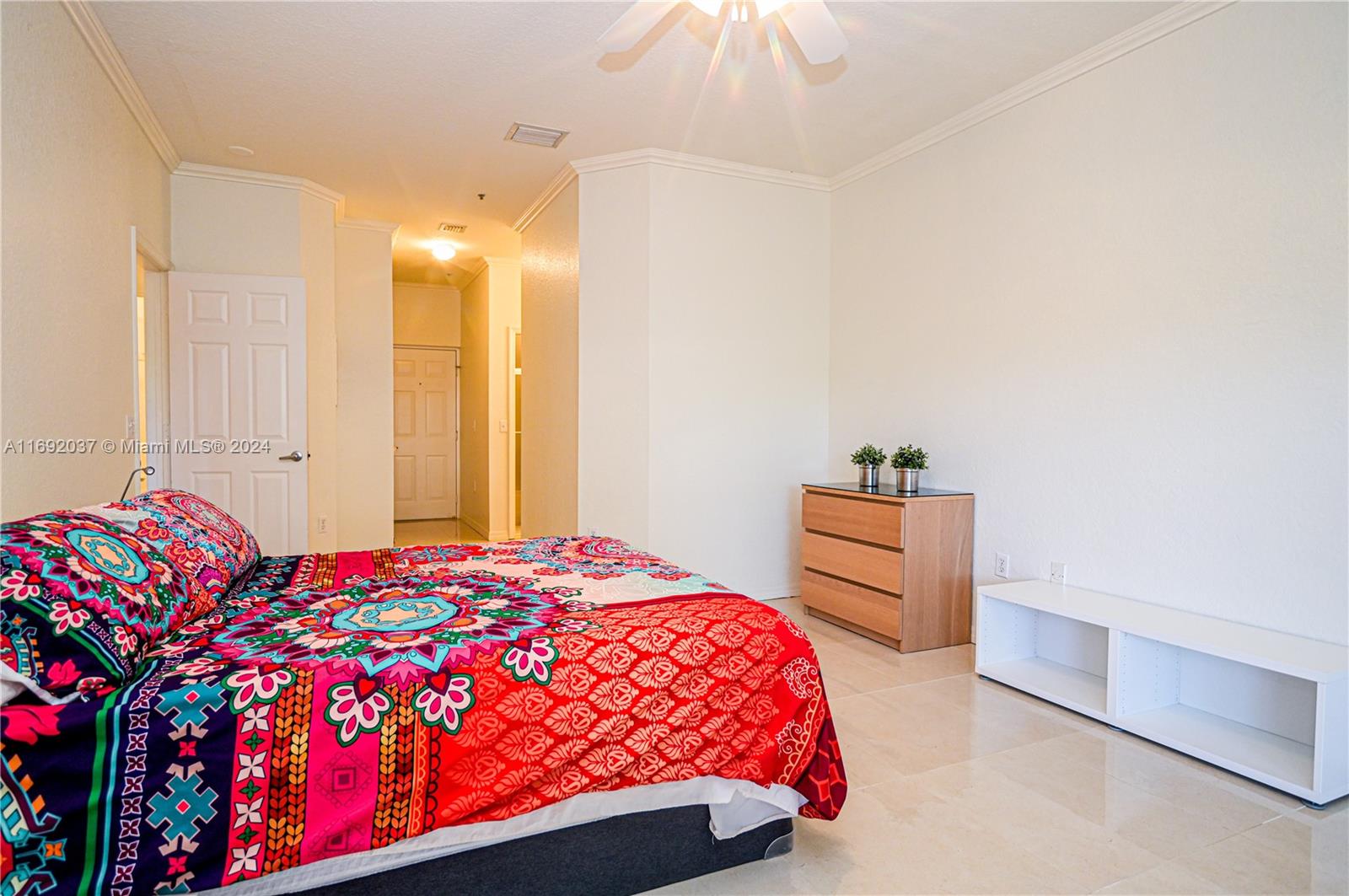 75 Gulfstream Road, Unit 107B Dania Beach, FL 33004 - Photo 43 of 71 a bedroom with a bed and a cabinets