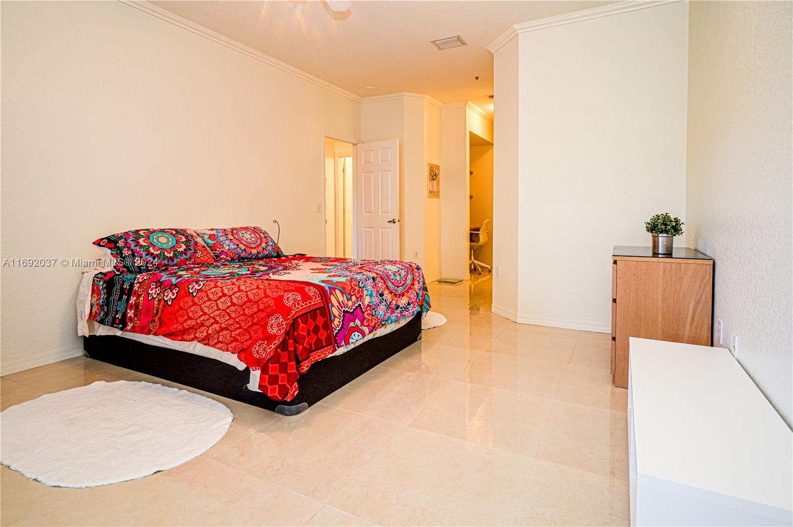 75 Gulfstream Road, Unit 107B Dania Beach, FL 33004 - Photo 44 of 71 a bedroom with a bed lamp and a large window