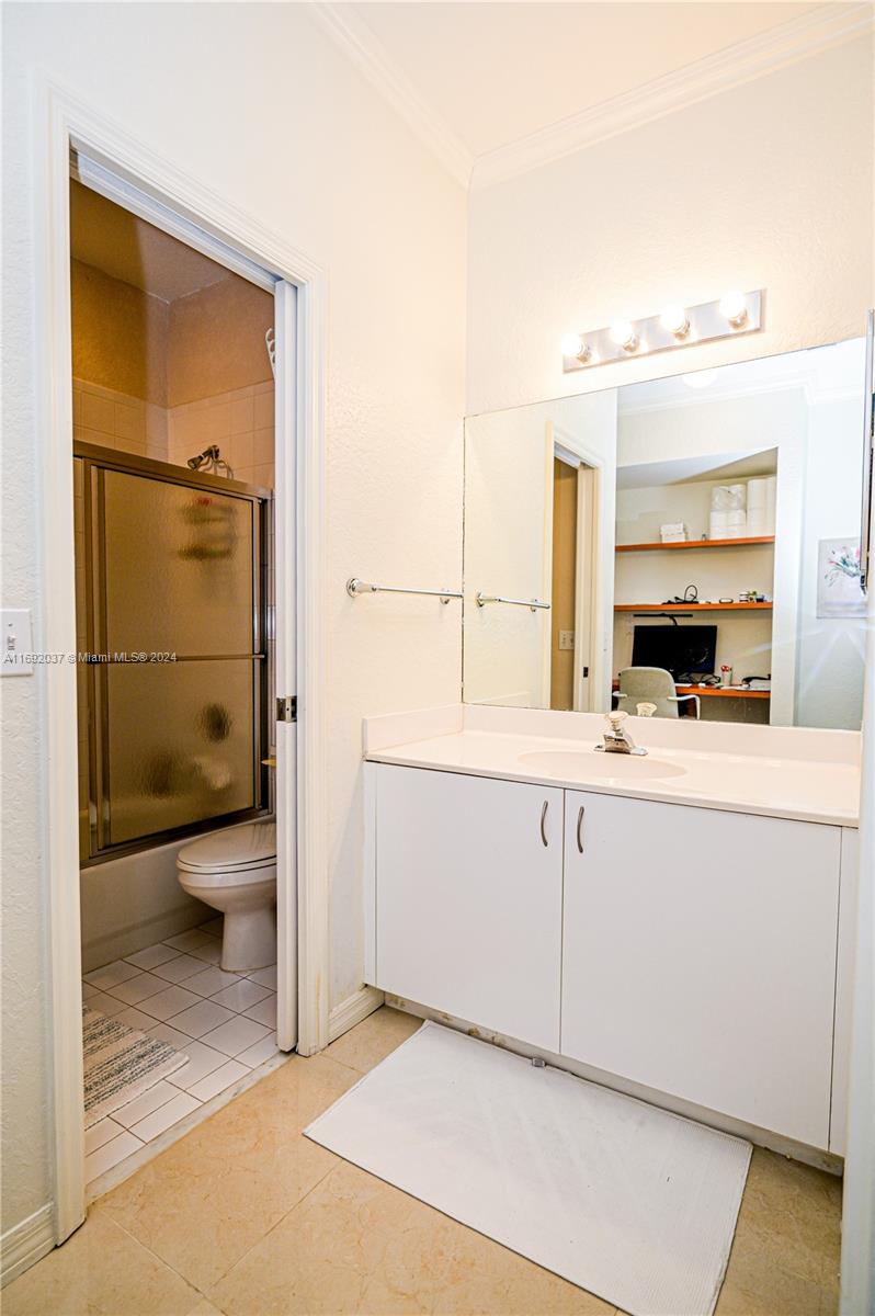 75 Gulfstream Road, Unit 107B Dania Beach, FL 33004 - Photo 46 of 71 a bathroom with a sink a toilet and shower