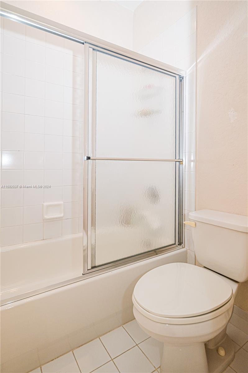 75 Gulfstream Road, Unit 107B Dania Beach, FL 33004 - Photo 47 of 71 a bathroom with a toilet and a shower