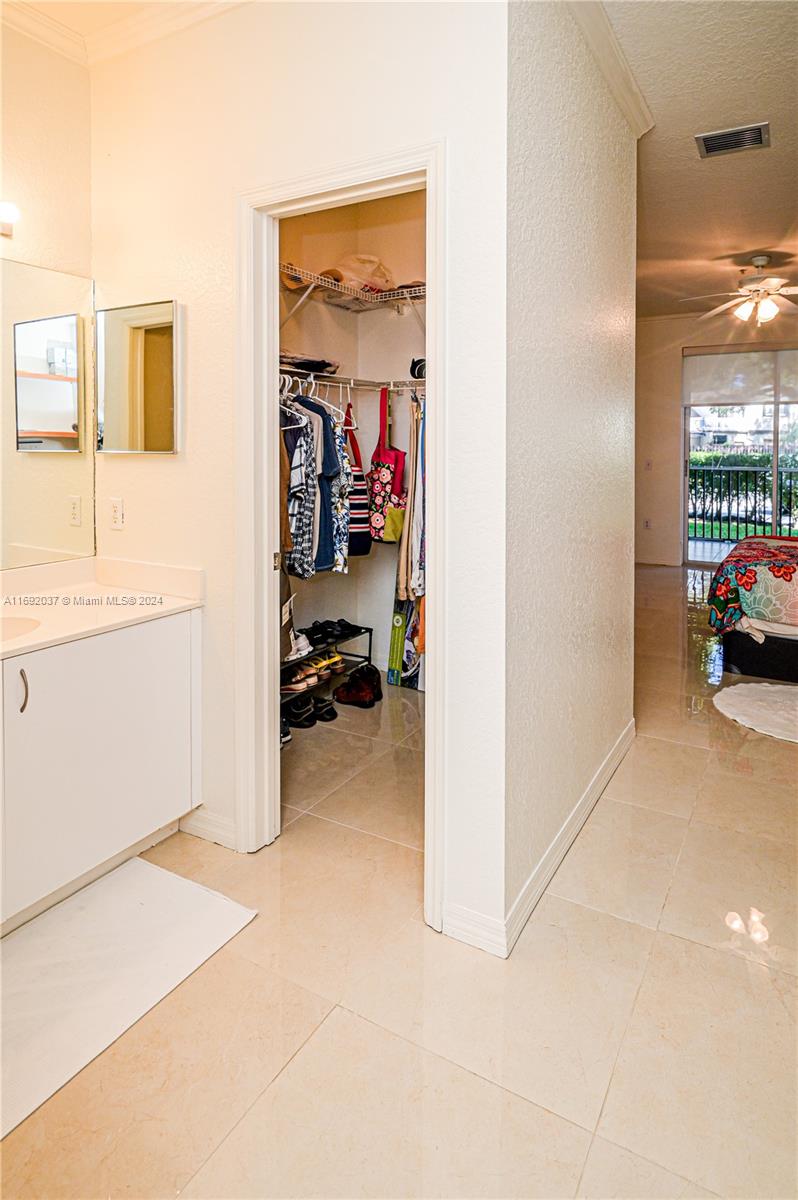 75 Gulfstream Road, Unit 107B Dania Beach, FL 33004 - Photo 49 of 71 a view of a livingroom with wooden floor and a ceiling fan
