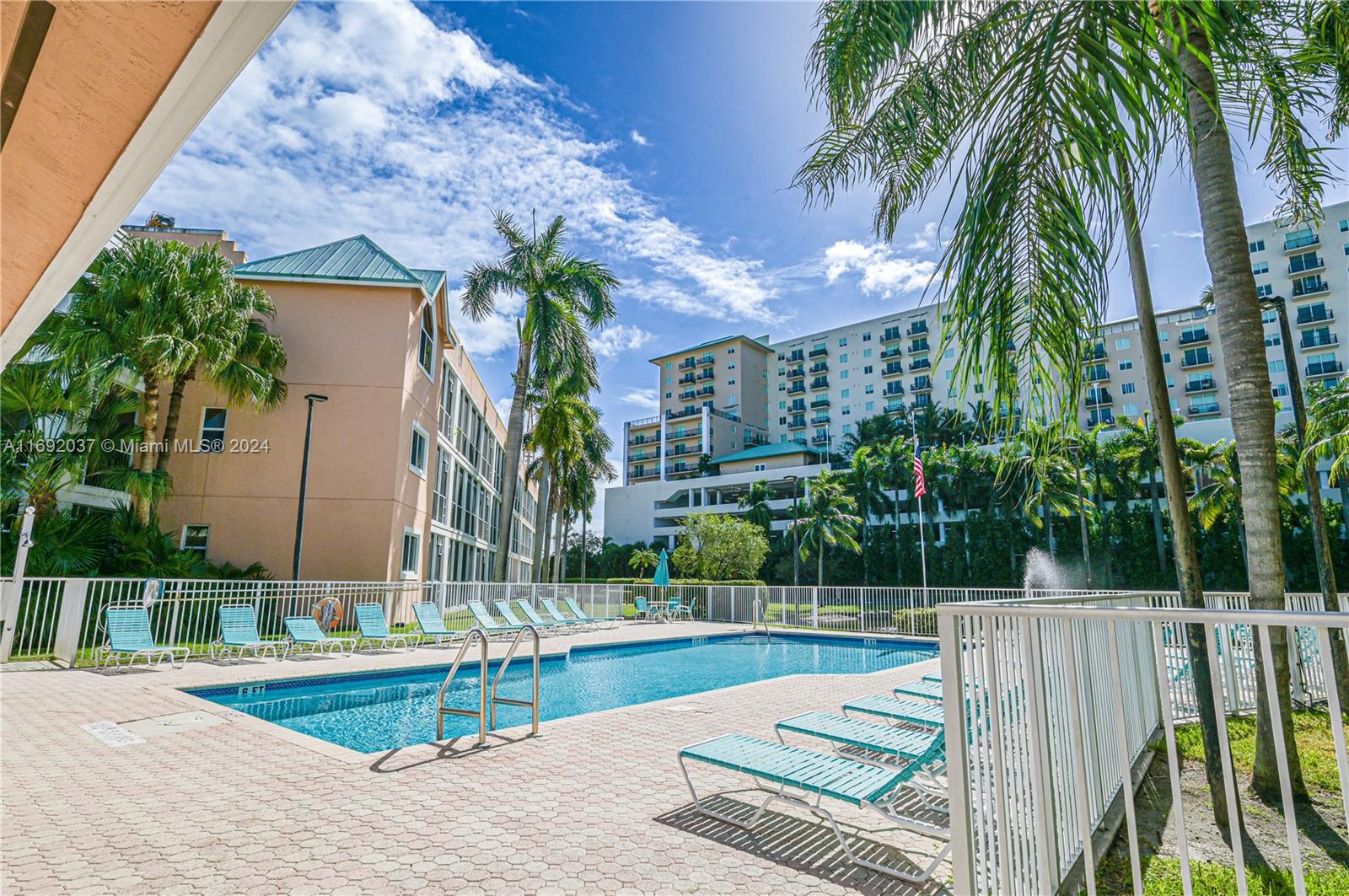 75 Gulfstream Road, Unit 107B Dania Beach, FL 33004 - Photo 60 of 71 a view of a palm trees in front of a house