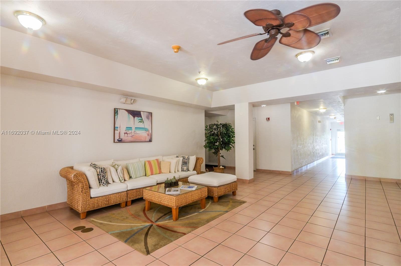 75 Gulfstream Road, Unit 107B Dania Beach, FL 33004 - Photo 70 of 71 a living room with furniture and a rug