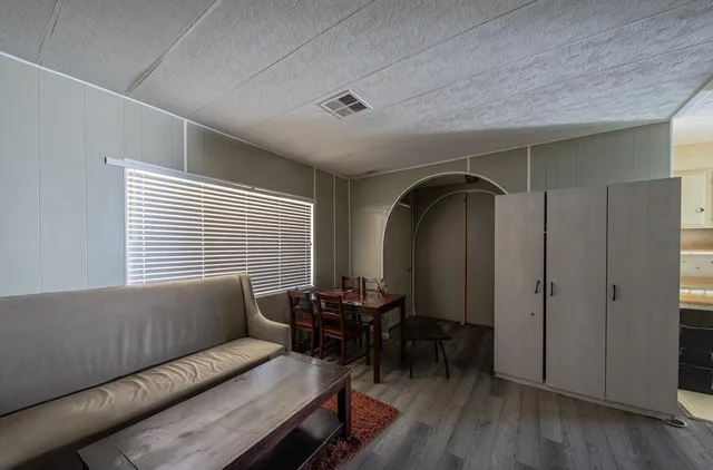 a view of a livingroom with furniture and a window