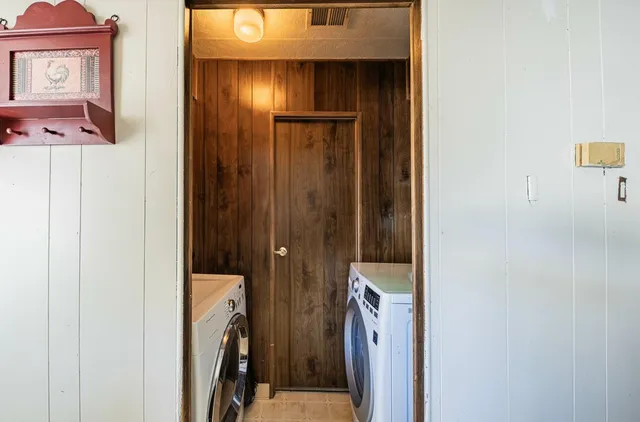 a bathroom with a sink toilet and mirror