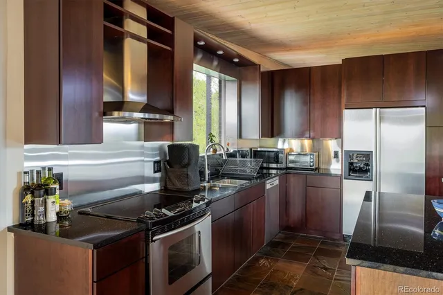 a kitchen with granite countertop lots of counter top space
