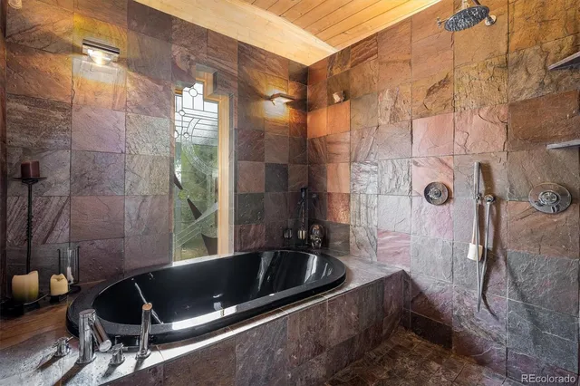 a living room with furniture a rug and a large window