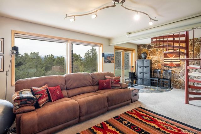 a living room with a couch and a large window