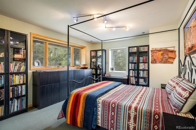 a view of a kitchen with workspace and windows
