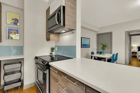 a kitchen with a large window and a sink