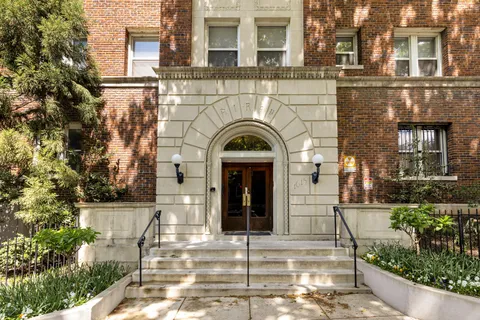 a view of a brick building with many windows