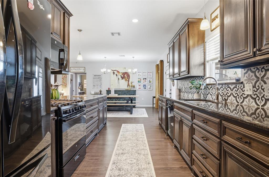 12992 Old Dallas Road West, TX 76691 - Photo 12 of 25 a view of a kitchen with stainless steel appliances