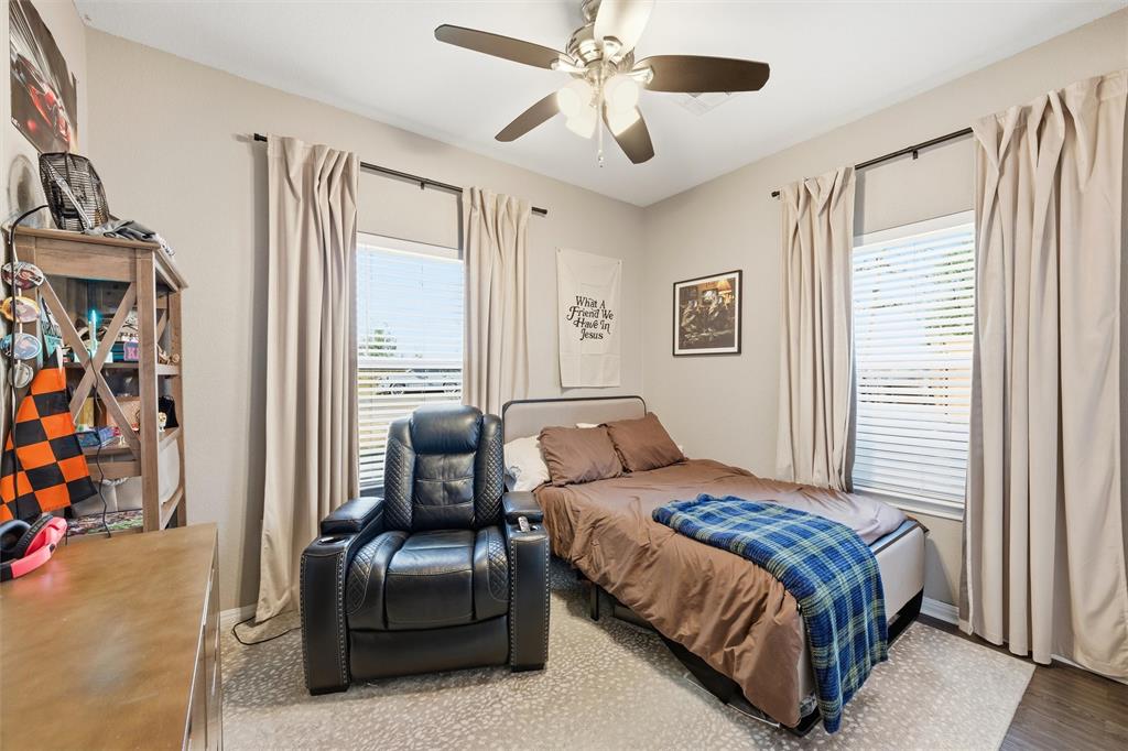 12992 Old Dallas Road West, TX 76691 - Photo 17 of 25 a bedroom with a bed couch and a window