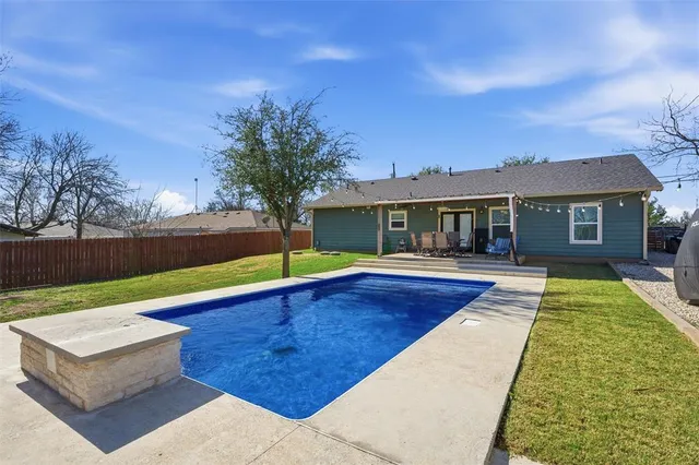 a view of a house with swimming pool