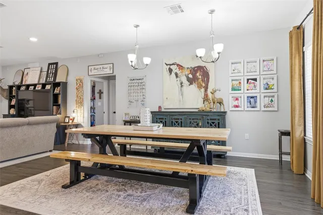 a living room with lots of furniture and a table