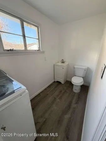 a bathroom with a toilet and a sink
