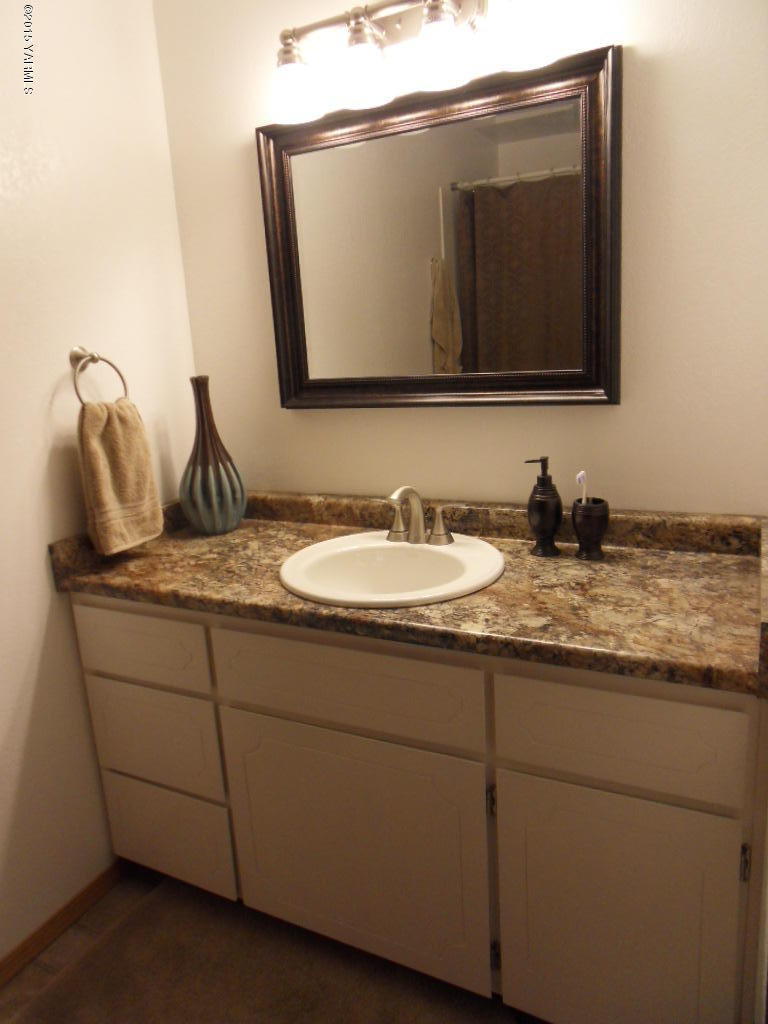 3501 Wiley Road Yakima, WA 98903 - Photo 13 of 31 a bathroom with a granite countertop sink and a mirror