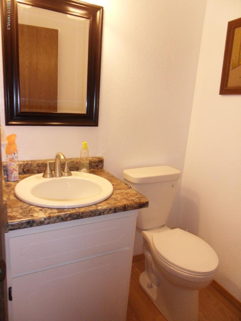 3501 Wiley Road Yakima, WA 98903 - Photo 19 of 31 a bathroom with a toilet sink and mirror