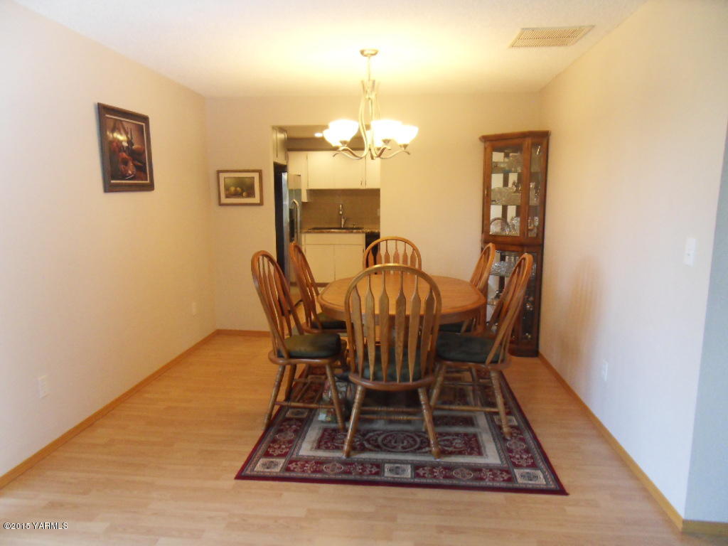 3501 Wiley Road Yakima, WA 98903 - Photo 7 of 31 a view of a dining room with furniture and chandelier