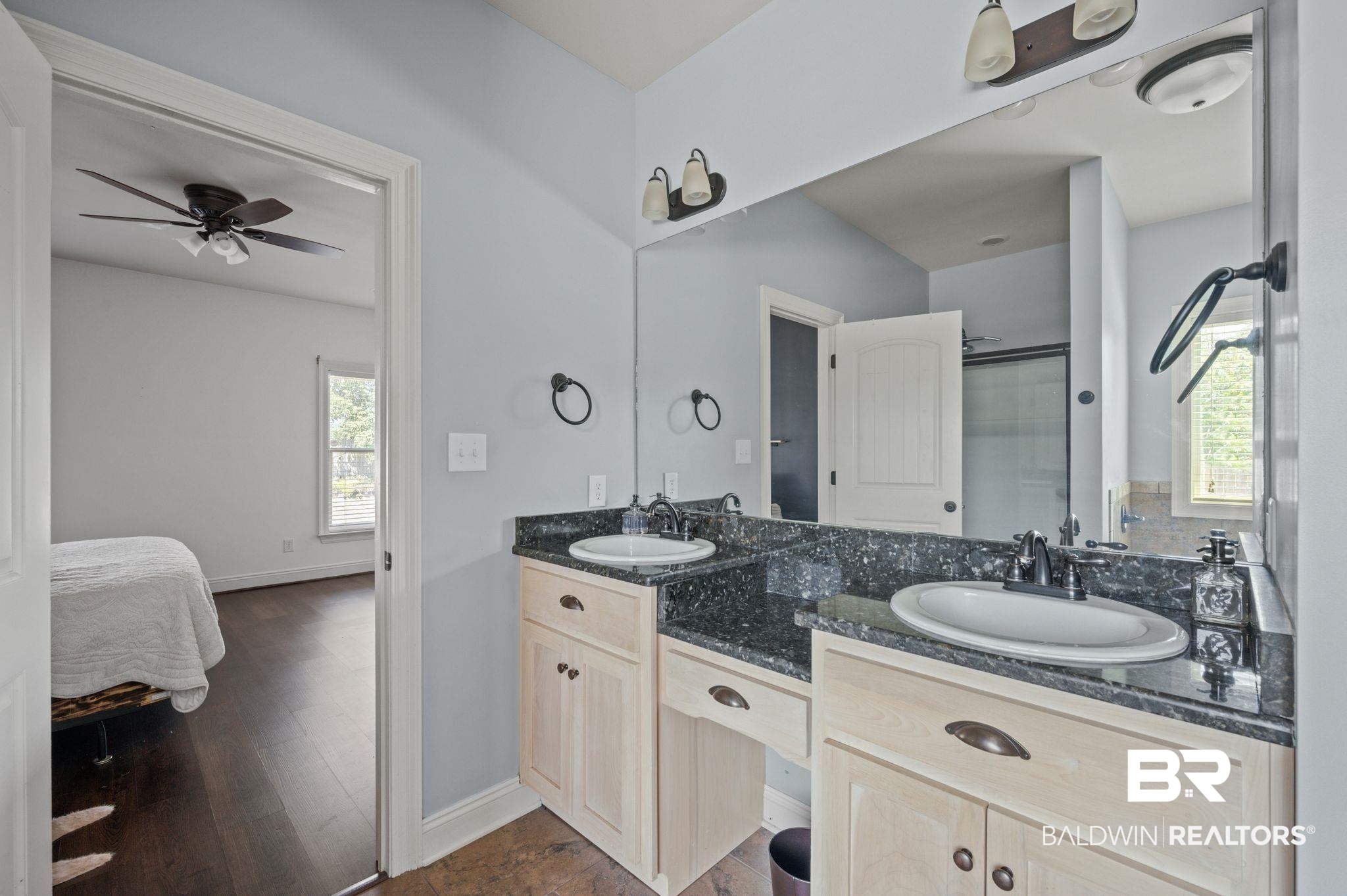 3879 Symphony Way West Semmes, AL 36575 - Photo 23 of 34 Bathroom featuring a wealth of natural light, ceiling fan, hardwood / wood-style flooring, and dual bowl vanity