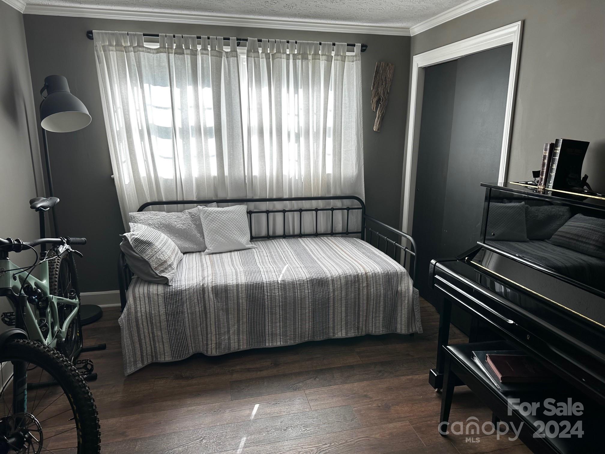 303 Legion Road Hudson, NC 28638 - Photo 14 of 32 a bedroom with a bed and windows